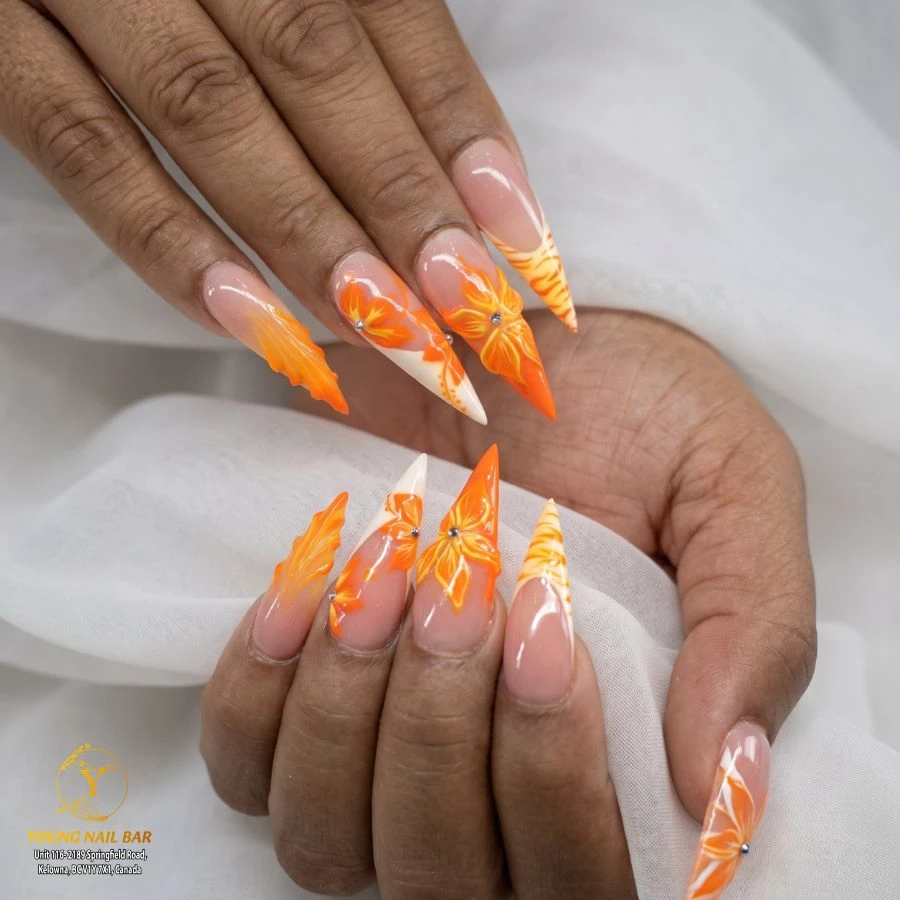 Orange floral nail art at Young Nail Bar