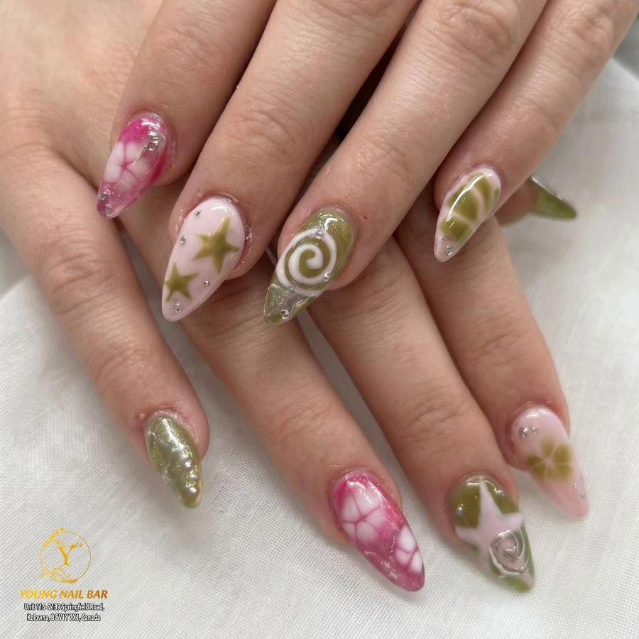 Green and pink swirl nail art at Young Nail Bar