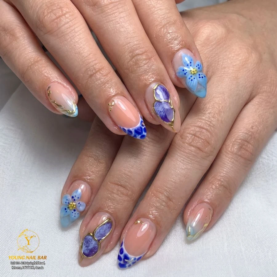 Blue floral nail art by Young Nail Bar